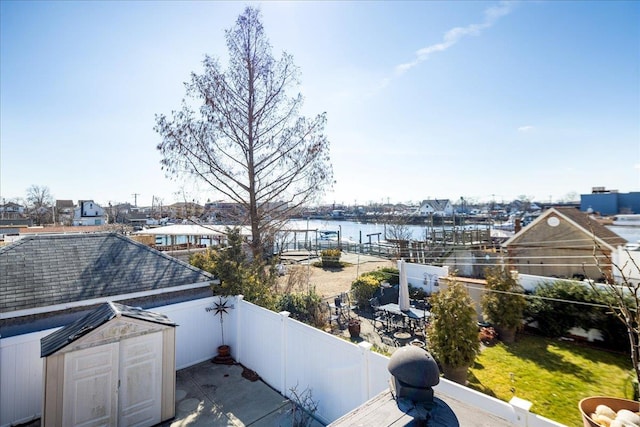 view of patio / terrace with a water view and a balcony