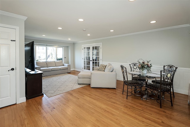 living area featuring recessed lighting, french doors, light wood-style floors, and ornamental molding