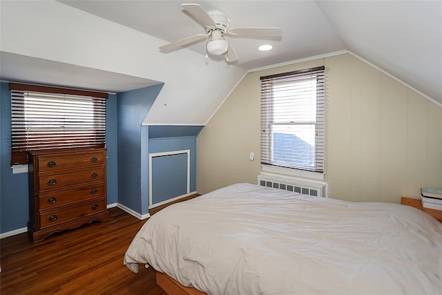 bedroom featuring dark wood-style floors, radiator, a ceiling fan, and lofted ceiling