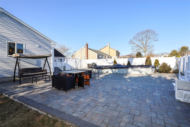 view of patio featuring a fenced in pool and a fenced backyard