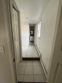 hallway with light tile patterned floors