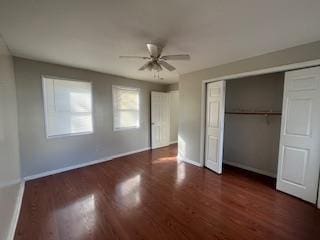 unfurnished bedroom featuring ceiling fan, a closet, wood finished floors, and baseboards