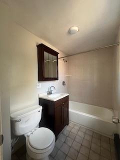 full bathroom with toilet, tile patterned floors, vanity, and shower / bathtub combination