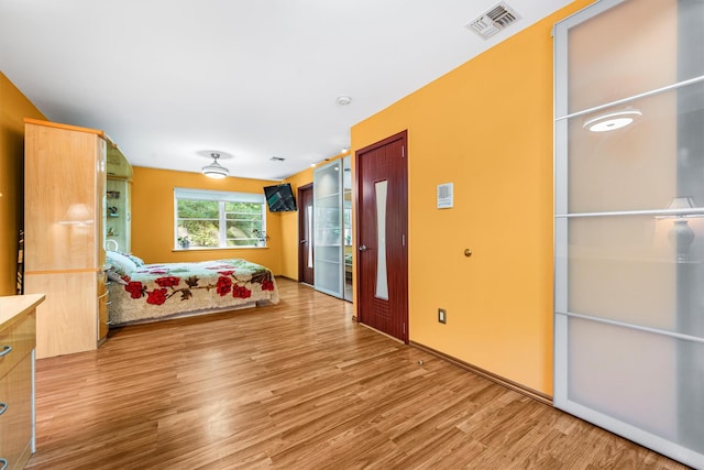 interior space featuring wood finished floors and visible vents