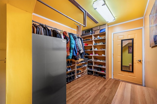 spacious closet with wood finished floors