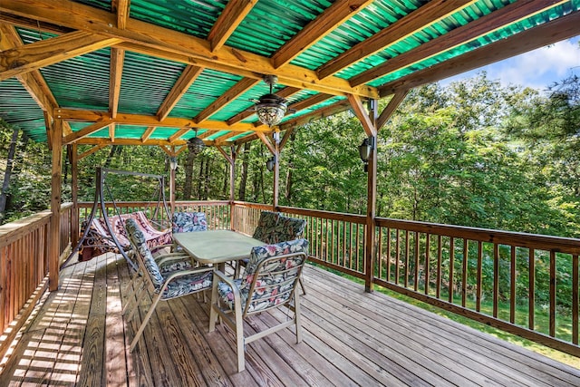 wooden terrace with outdoor dining area