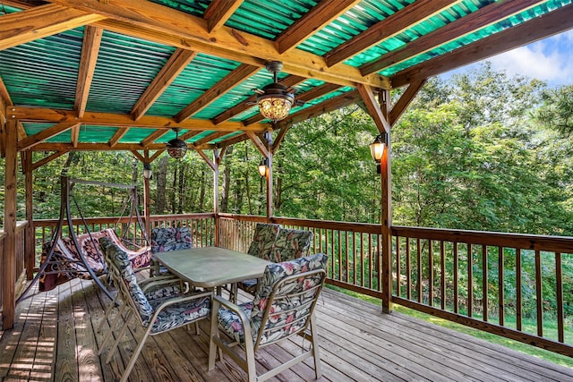 wooden terrace with outdoor dining space