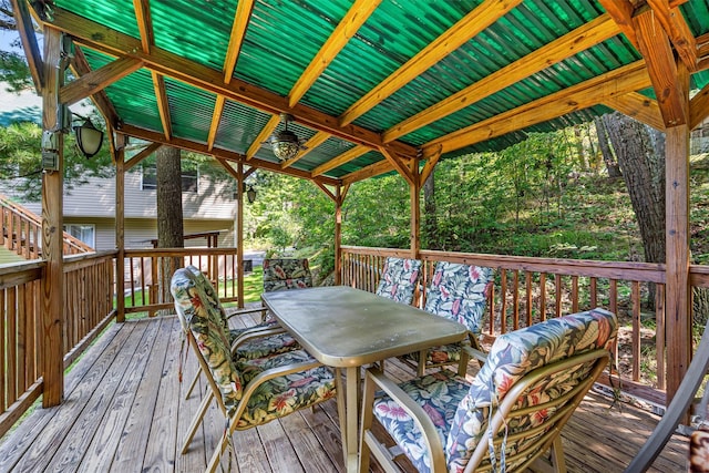 wooden terrace featuring outdoor dining space