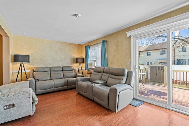 living room featuring wood finished floors and a healthy amount of sunlight