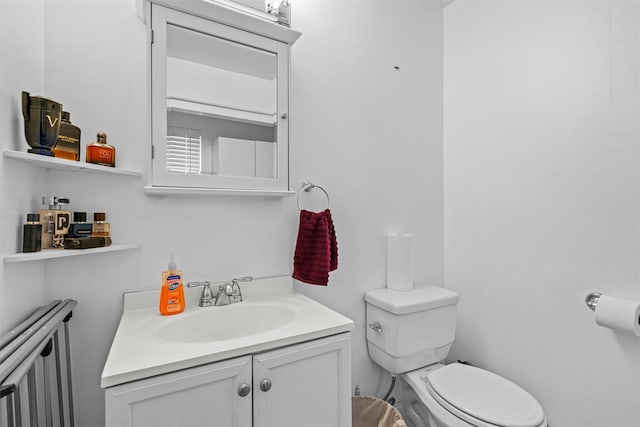 bathroom with toilet and vanity