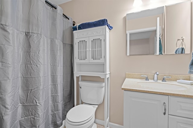 bathroom featuring vanity, toilet, and a shower with curtain