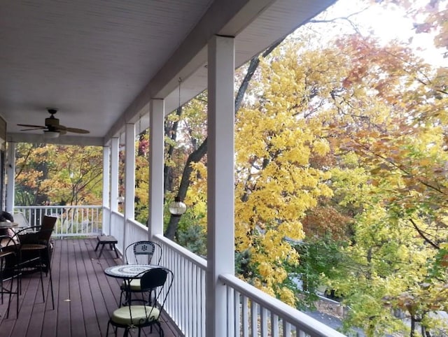 wooden deck featuring a ceiling fan