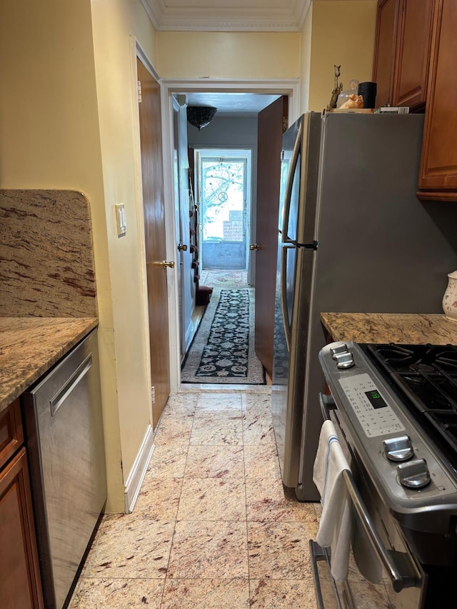 42-30 196th St, Flushing, NY 11358 - kitchen with brown cabinetry, crown molding, stone counters, baseboards, and gas stove