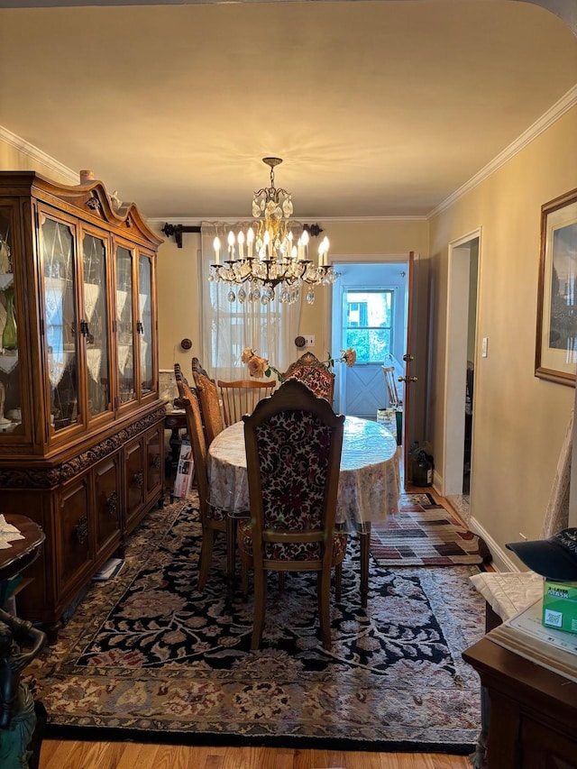 42-30 196th St, Flushing, NY 11358 - dining area featuring crown molding, an inviting chandelier, and dark wood finished floors