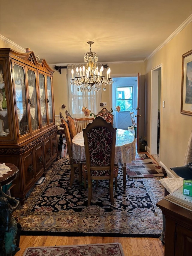 42-30 196th St, Flushing, NY 11358 - dining space with an inviting chandelier, wood finished floors, and crown molding