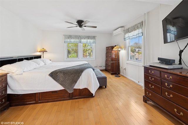 119 Cassilis Ave, Bronxville, NY 10708 - bedroom with a wall mounted AC, a baseboard radiator, light wood-style floors, and ceiling fan