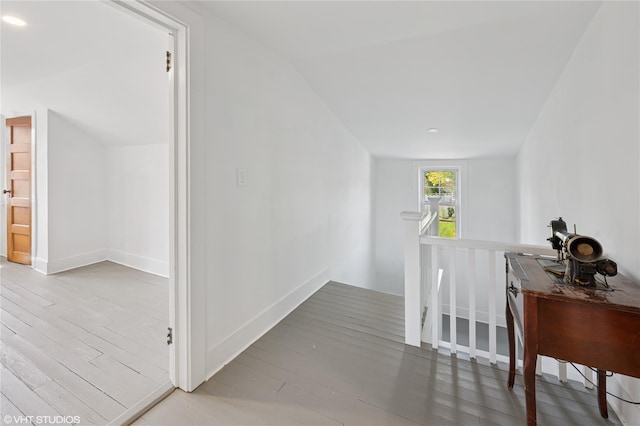 119 Cassilis Ave, Bronxville, NY 10708 - corridor with an upstairs landing, wood finished floors, and vaulted ceiling