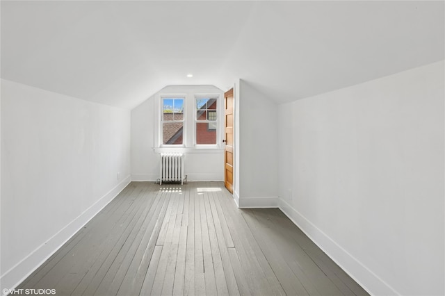 119 Cassilis Ave, Bronxville, NY 10708 - additional living space featuring radiator heating unit, lofted ceiling, wood-type flooring, and baseboards