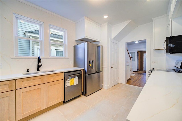 kitchen featuring dishwashing machine, range with electric cooktop, ornamental molding, a sink, and stainless steel refrigerator with ice dispenser