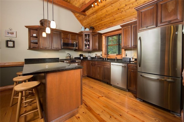 kitchen with decorative light fixtures, light wood finished floors, stainless steel appliances, glass insert cabinets, and wood ceiling