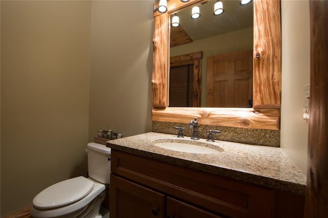 half bath with toilet and vanity