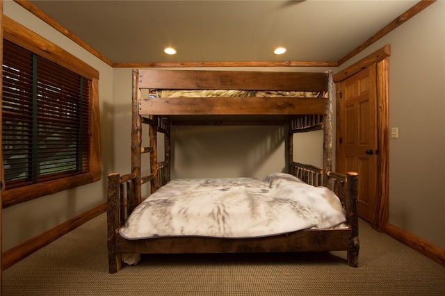 carpeted bedroom featuring baseboards and recessed lighting