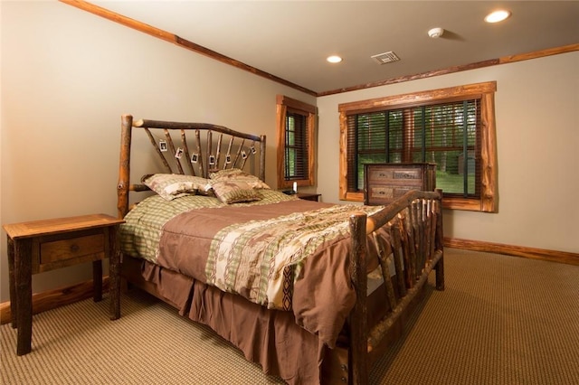 carpeted bedroom with recessed lighting, visible vents, crown molding, and baseboards