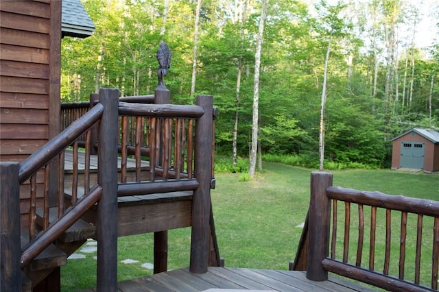 wooden deck with a yard, a shed, and an outdoor structure