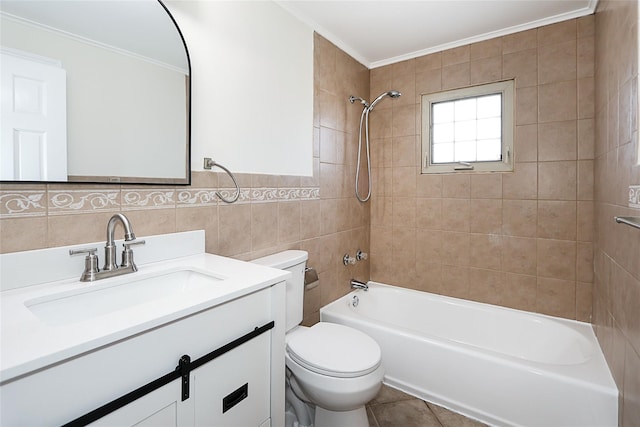 full bath with bathing tub / shower combination, toilet, ornamental molding, vanity, and tile walls