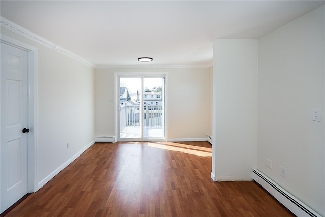 unfurnished room featuring ornamental molding, baseboards, baseboard heating, and wood finished floors