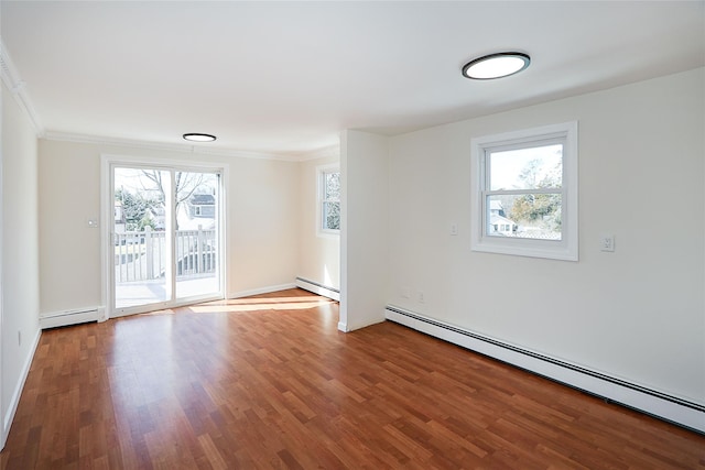 empty room with a baseboard radiator and wood finished floors