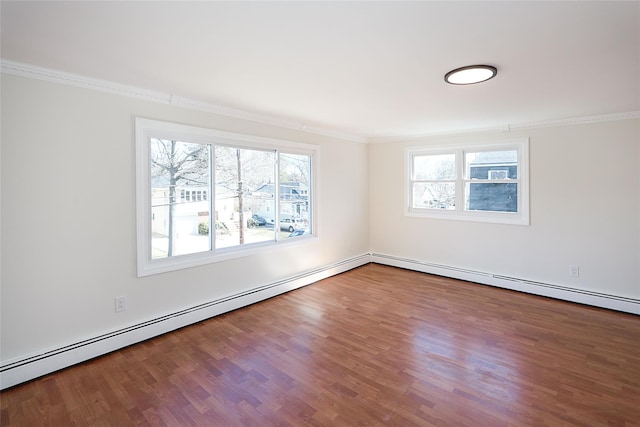 unfurnished room featuring ornamental molding, a baseboard radiator, and wood finished floors