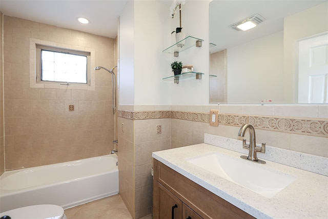 full bathroom featuring tile patterned flooring, shower / tub combination, a wainscoted wall, vanity, and tile walls