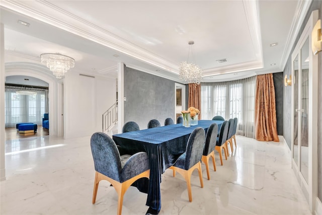 dining space featuring visible vents, crown molding, a raised ceiling, marble finish floor, and a chandelier