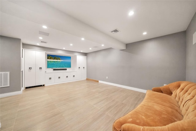 living room with visible vents and baseboards