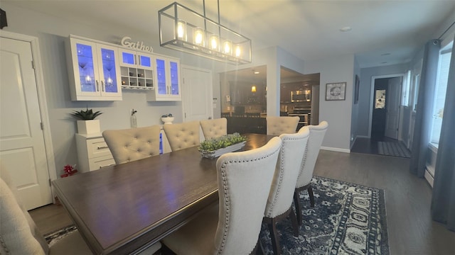 dining area featuring dark wood finished floors