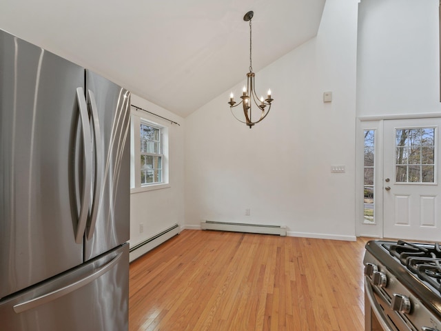 kitchen with light wood-style floors, stainless steel appliances, baseboard heating, and high vaulted ceiling