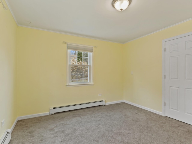 carpeted empty room with baseboards, baseboard heating, and ornamental molding