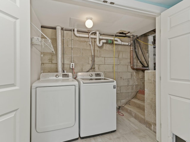 washroom with washing machine and clothes dryer