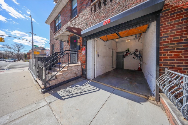 property entrance featuring brick siding