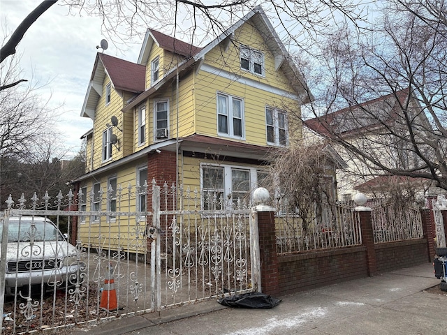 view of side of home featuring a fenced front yard