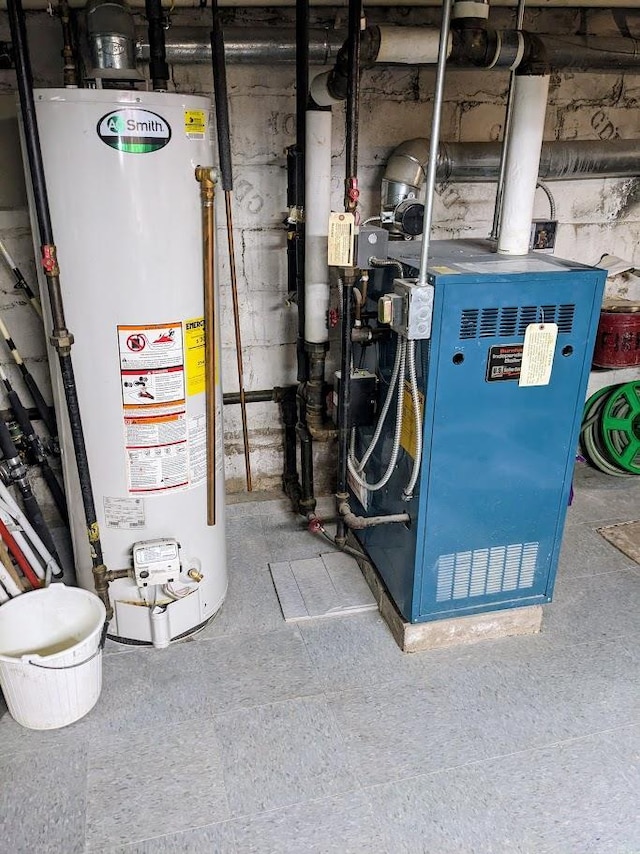 utility room with water heater and a heating unit