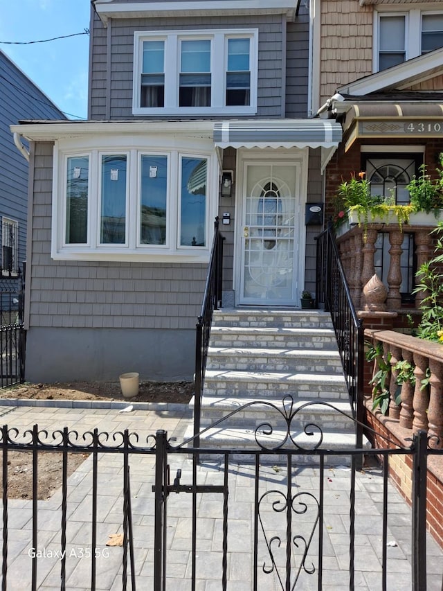 doorway to property with fence