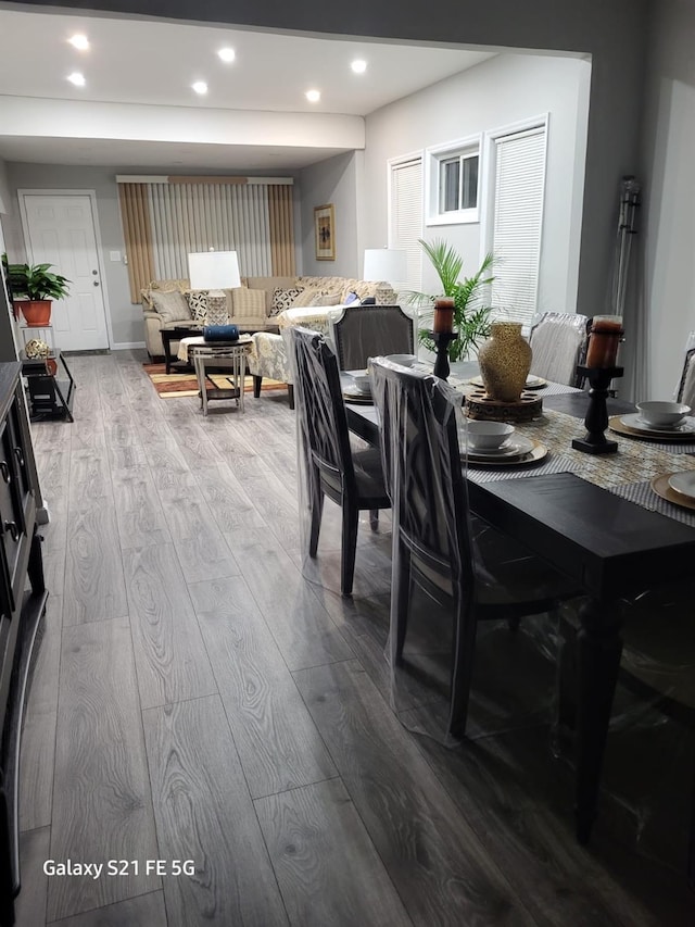 dining area featuring recessed lighting and wood finished floors