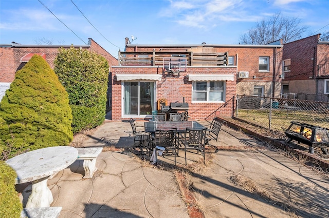 view of patio featuring outdoor dining area and fence