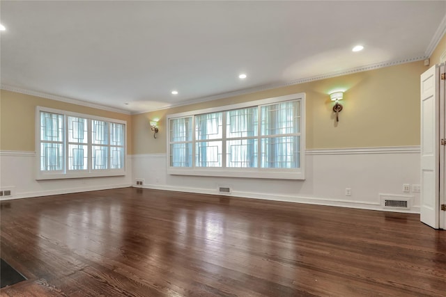 unfurnished living room featuring crown molding, visible vents, and dark wood-type flooring