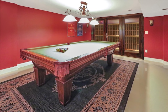 game room featuring pool table and baseboards