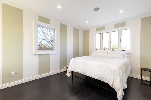 bedroom with crown molding, baseboards, recessed lighting, and dark wood finished floors