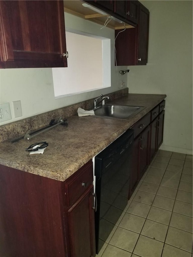 kitchen with black dishwasher, light tile patterned flooring, a sink, and reddish brown cabinets