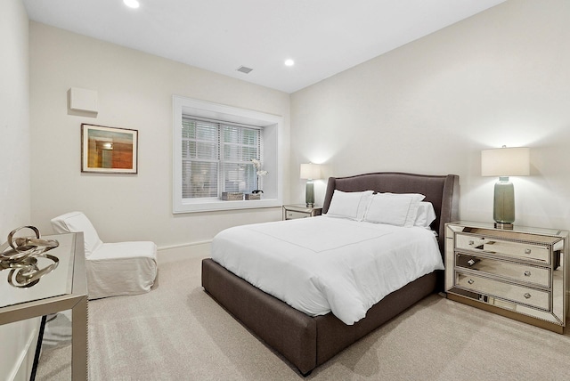 bedroom featuring recessed lighting, light carpet, visible vents, and baseboards